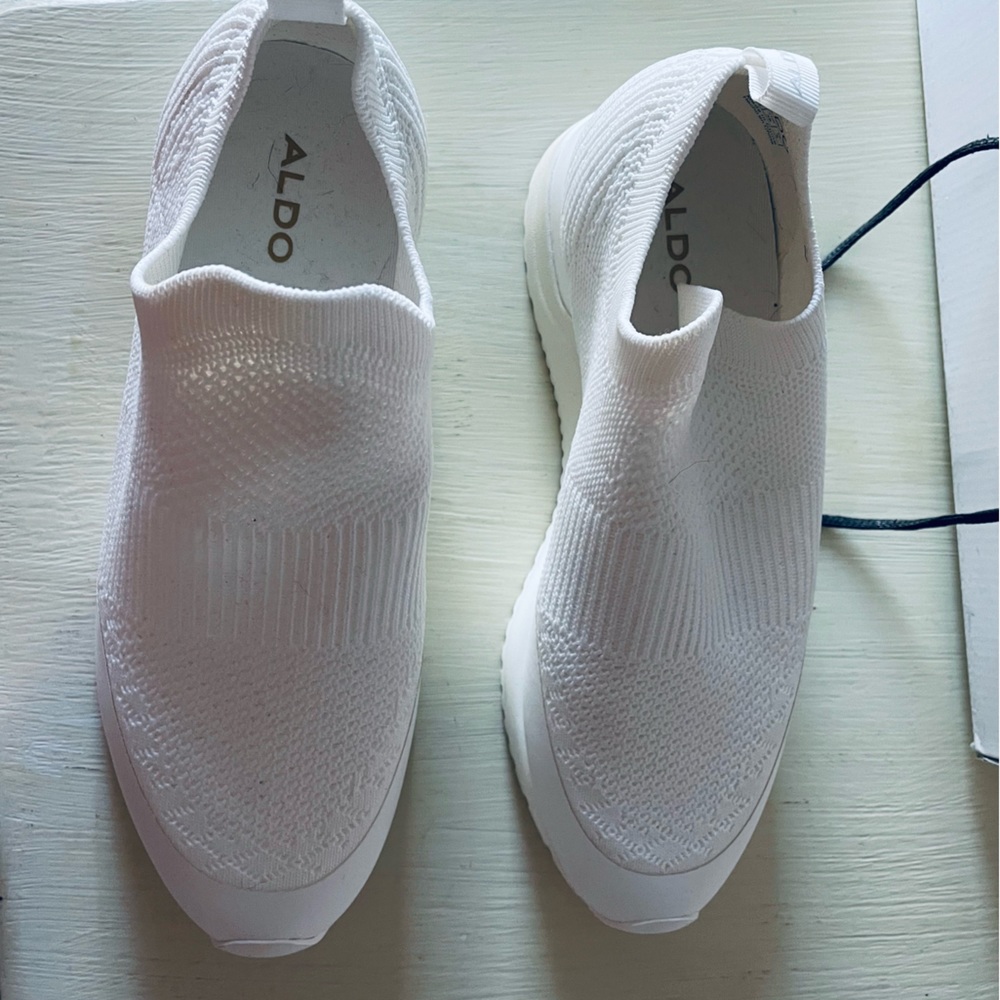 Brand new, white, slip-on fashion sneaker by Aldo.